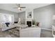 Living room featuring a fireplace, ceiling fan, and plush seating arrangement at 104 Musgrove Cir, Cary, NC 27518
