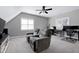 Cozy living room with a comfortable reclining loveseat with two workstations and a television at 104 Musgrove Cir, Cary, NC 27518