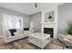 Comfortable living room with fireplace, modern coffee table, and stylish decor at 104 Musgrove Cir, Cary, NC 27518