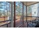 Spacious screened porch with outdoor furniture overlooking the wooded backyard at 104 Musgrove Cir, Cary, NC 27518
