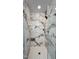 Modern marble shower with glass doors and mosaic tile floor at 104 Musgrove Cir, Cary, NC 27518