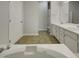 Well lit bathroom with double sink vanity, walk in shower, toilet, and a soaking tub at 104 Walnut Creek Dr, Clayton, NC 27520