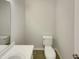 This bathroom includes a toilet and sink with a neutral color scheme at 104 Walnut Creek Dr, Clayton, NC 27520