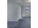 Neutral bedroom offers a large door and one window to let in natural light at 104 Walnut Creek Dr, Clayton, NC 27520
