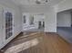 Bright dining room featuring hardwood floors, open access to the kitchen, and french doors to the deck at 104 Walnut Creek Dr, Clayton, NC 27520