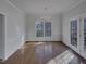A light-filled dining room with hardwood floors and a large window with backyard views at 104 Walnut Creek Dr, Clayton, NC 27520