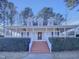 Charming one-story home with a welcoming front porch and manicured landscaping at 104 Walnut Creek Dr, Clayton, NC 27520