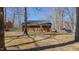 Spacious backyard surrounded by mature trees and a secure chain-link fence at 1253 Skyview Dr, Mebane, NC 27302