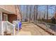 Backyard view featuring a brick home, steps, and a fence at 1253 Skyview Dr, Mebane, NC 27302