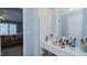 Bathroom with white vanity, mirror, and a view into a bedroom at 1253 Skyview Dr, Mebane, NC 27302