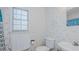 Full bathroom with floral wallpaper, window and a shower and tub combo at 1253 Skyview Dr, Mebane, NC 27302
