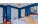 Dark blue bedroom with a queen bed and double door closet at 1253 Skyview Dr, Mebane, NC 27302