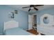 Light blue bedroom features a bed and white dresser at 1253 Skyview Dr, Mebane, NC 27302