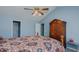 Bedroom boasts vaulted ceilings, ceiling fan, and a decorative wood bed at 1253 Skyview Dr, Mebane, NC 27302