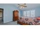 Bedroom features vaulted ceilings, a ceiling fan, and dark wood accents at 1253 Skyview Dr, Mebane, NC 27302