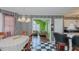 Well-lit dining room with an open view to the living room, with unique striped walls at 1253 Skyview Dr, Mebane, NC 27302
