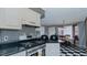 Traditional kitchen featuring black appliances, and striped wallpaper with breakfast nook at 1253 Skyview Dr, Mebane, NC 27302