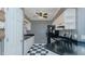 Functional kitchen with ample counter space and storage, and classic black and white tile floors at 1253 Skyview Dr, Mebane, NC 27302