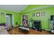 Open living room with views into the dining and kitchen, with hardwood floors at 1253 Skyview Dr, Mebane, NC 27302