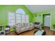 Inviting living room filled with natural light, hardwood floors, and a large window at 1253 Skyview Dr, Mebane, NC 27302