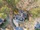 Overhead view of a home with a complex roof structure and landscaping surrounded by a wooded area at 126 Maltland Dr, Cary, NC 27518