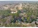Wide aerial view of a neighborhood with a golf course and lake in the background at 126 Maltland Dr, Cary, NC 27518