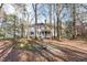 Large, private backyard with mature trees, providing a serene outdoor setting at 126 Maltland Dr, Cary, NC 27518