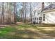 Spacious backyard featuring mature trees and green grass, ideal for outdoor activities at 126 Maltland Dr, Cary, NC 27518