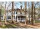 Spacious backyard featuring mature trees providing shade and privacy for outdoor enjoyment at 126 Maltland Dr, Cary, NC 27518
