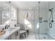 Modern bathroom with a glass shower, sleek fixtures, and marble-style flooring at 126 Maltland Dr, Cary, NC 27518