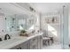 Bathroom featuring a double sink vanity with a glass shower and natural light at 126 Maltland Dr, Cary, NC 27518