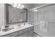 Bright bathroom with a glass-enclosed shower, white cabinets, and a large mirror, offering a fresh design at 126 Maltland Dr, Cary, NC 27518