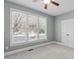 Serene bedroom with natural light, a ceiling fan, and neutral colors creating a calming space at 126 Maltland Dr, Cary, NC 27518