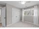 Comfortable bedroom with a window, ceiling fan, and closet for ample storage and natural light at 126 Maltland Dr, Cary, NC 27518
