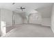 Expansive bonus room featuring a ceiling fan, carpet, and natural light, ideal for relaxation and activities at 126 Maltland Dr, Cary, NC 27518