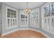 Sun-filled breakfast nook with three sets of windows and white shutters at 126 Maltland Dr, Cary, NC 27518