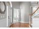 Inviting foyer with hardwood floors and a staircase leading to the upper level at 126 Maltland Dr, Cary, NC 27518