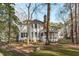 Charming home exterior with a screened porch and well-maintained backyard at 126 Maltland Dr, Cary, NC 27518