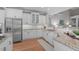 Stylish kitchen with granite countertops, white cabinets, and stainless steel appliances at 126 Maltland Dr, Cary, NC 27518