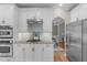 Eat-in kitchen featuring granite countertops, gas range, and stainless steel appliances at 126 Maltland Dr, Cary, NC 27518