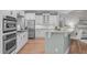 Modern kitchen with stainless steel appliances, granite countertops, and white cabinets at 126 Maltland Dr, Cary, NC 27518