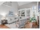 Warm living room featuring built-in shelving, a fireplace, and comfortable seating for a relaxing atmosphere at 126 Maltland Dr, Cary, NC 27518
