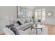 Beautifully staged living room with neutral tones, large windows, and modern decor at 126 Maltland Dr, Cary, NC 27518