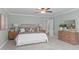 Bedroom with soft, neutral colors, a bed with decorative pillows, and lamps at 126 Maltland Dr, Cary, NC 27518