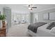 Spacious bedroom with a sitting area by a bay window and a ceiling fan at 126 Maltland Dr, Cary, NC 27518