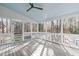 Inviting screened porch with a ceiling fan and wood floor, perfect for enjoying the outdoors at 126 Maltland Dr, Cary, NC 27518