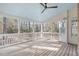 Inviting screened-in porch with wood flooring and ceiling fan, perfect for enjoying outdoor living at 126 Maltland Dr, Cary, NC 27518