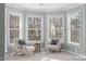 Cozy sitting area with chairs, bay windows, and light-colored walls and carpet at 126 Maltland Dr, Cary, NC 27518