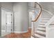 Elegant curved staircase with white railing and hardwood steps at 126 Maltland Dr, Cary, NC 27518