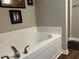 Bathroom featuring a large tub and walk-in shower at 133 Sandcastle Ln, Four Oaks, NC 27524